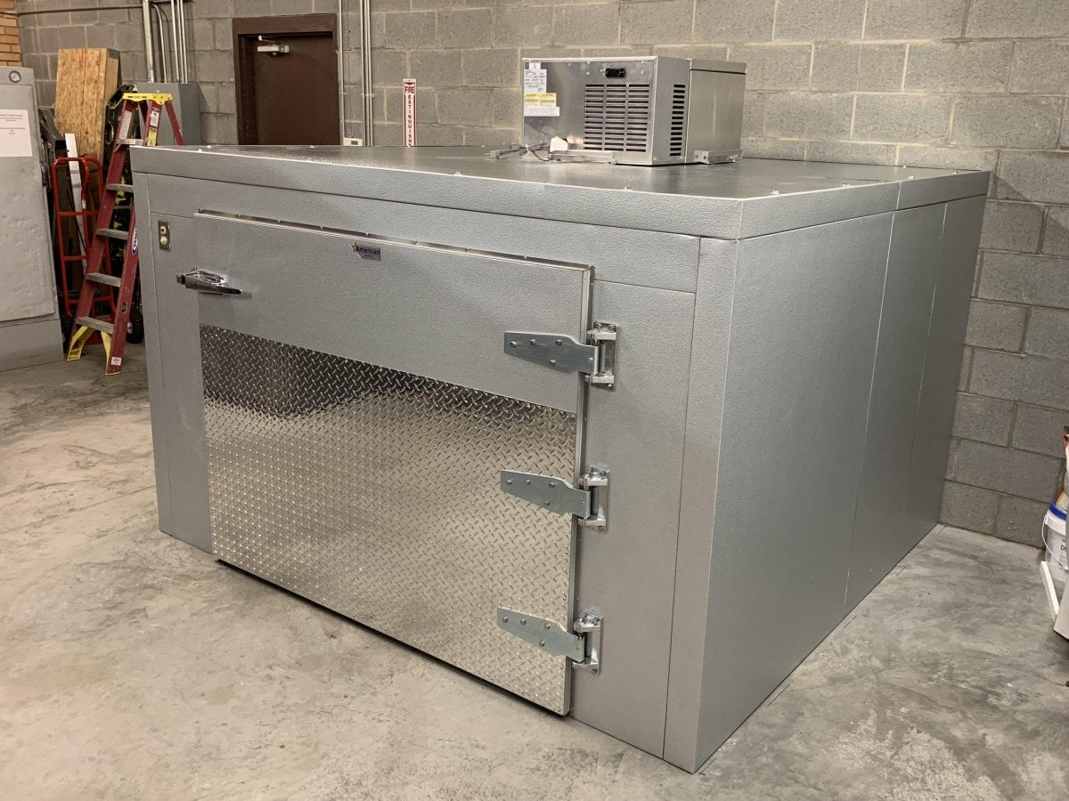 “Energy Act 2025 compliant mortuary cooler Model 2000-TR3C – includes drainage connection, copper stub, and OSHA-approved components.”