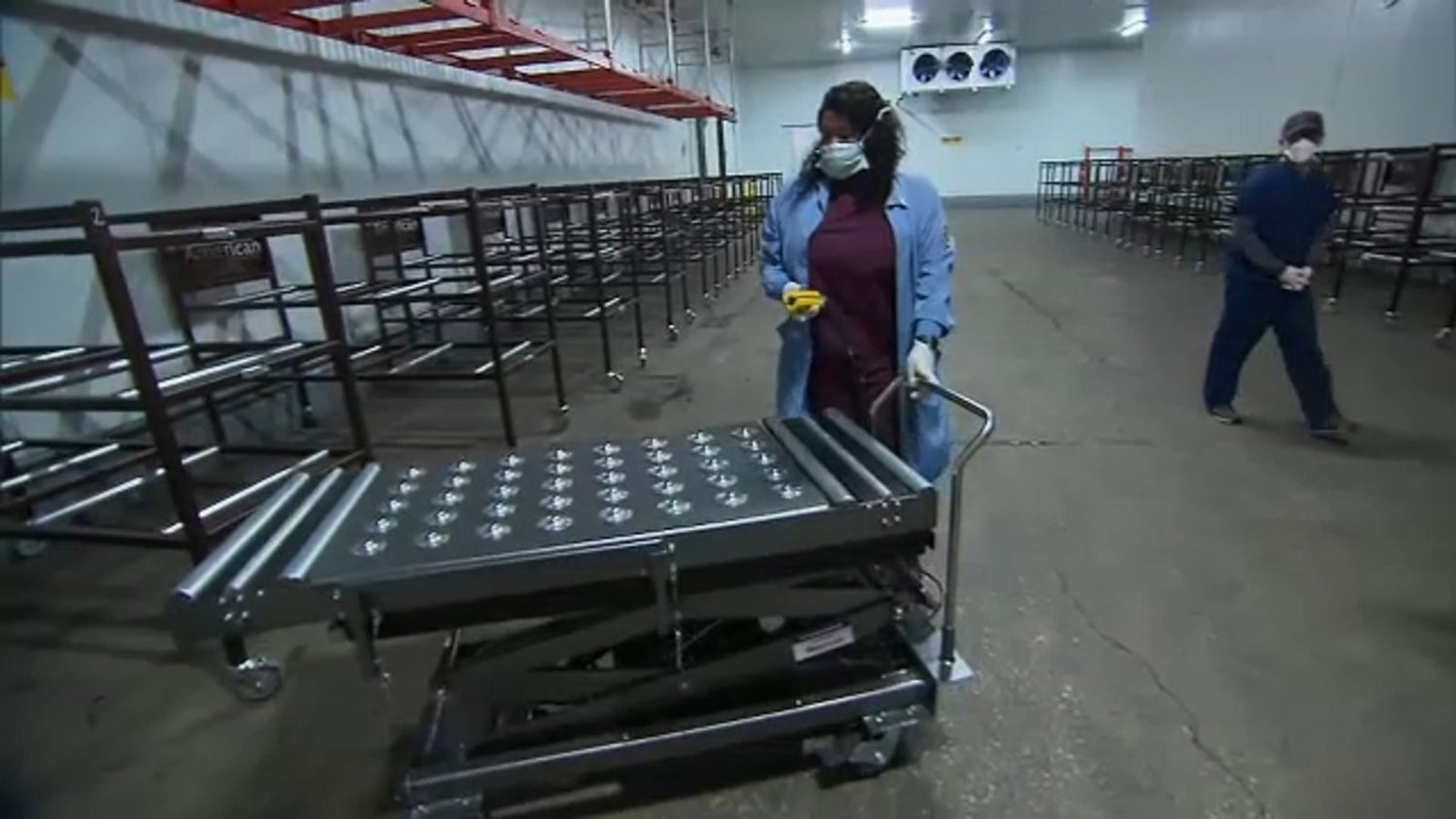 Interior view of mortuary cooler showing stainless storage trays and easy-to-clean surfaces for sanitary operation