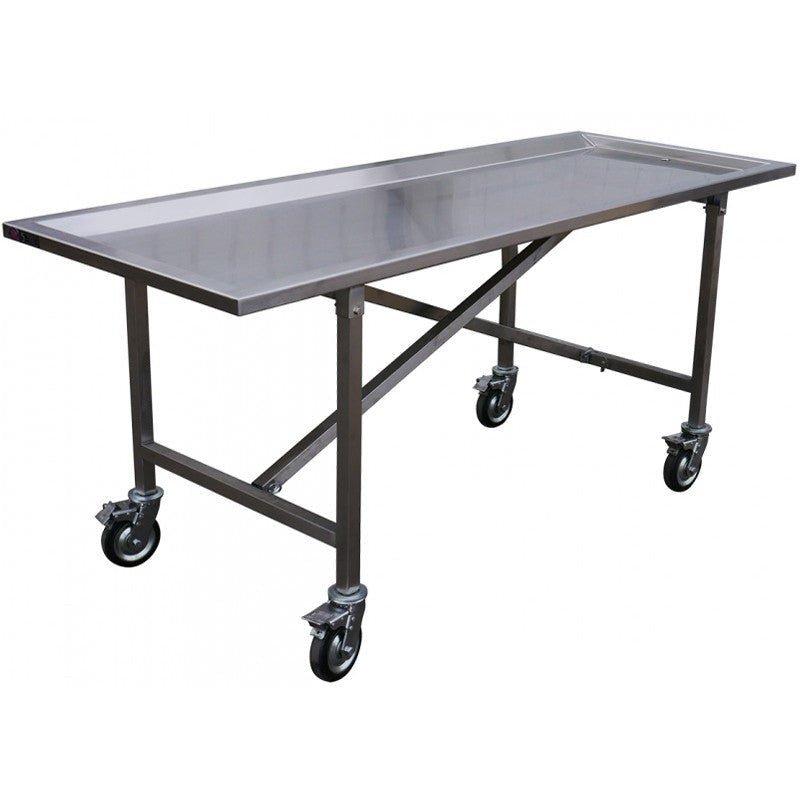 Hydraulic stainless steel embalming table with OSHA-compliant drainage system in funeral home prep room