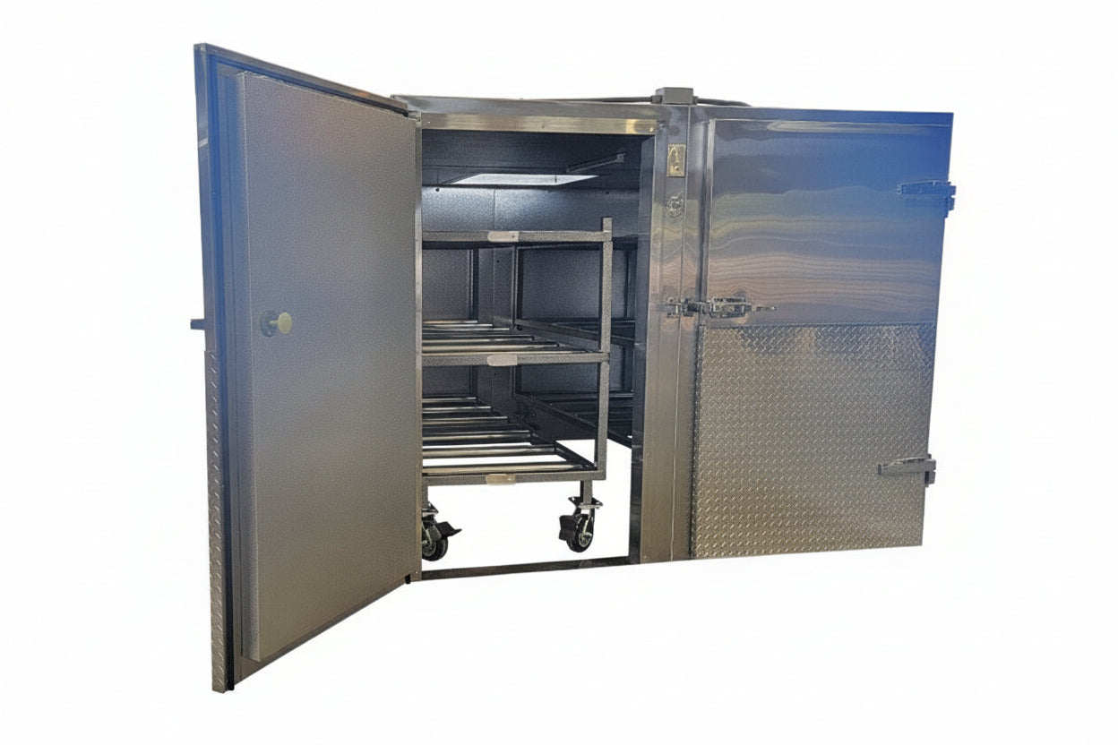 Internal view of the 6-body mortuary cooler showing two sets of 3-tier multi-directional roller racks for effortless loading and unloading of body trays in a high-volume facility.