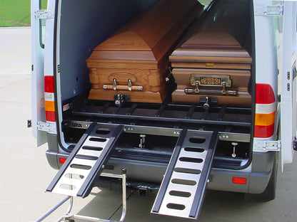 AME-DD4000 fully loaded with four caskets — American Mortuary Equipment professional-grade cargo van deck system for funeral transport