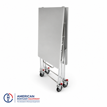 Folding mortuary dressing table collapsed flat for vertical storage between cases, stainless steel | American Mortuary Coolers