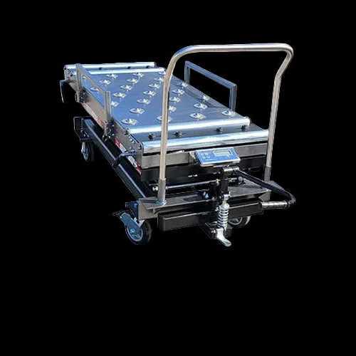 Funeral home scissor lift lowered to 20.5-inch loading height beside mortuary cooler