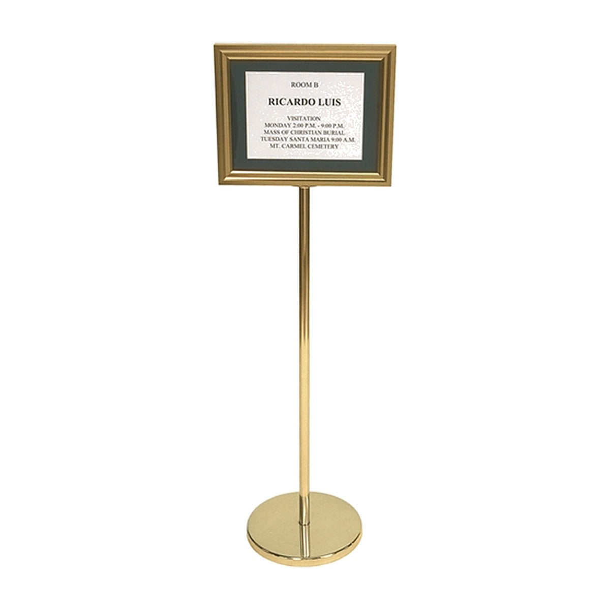 Back-opening pedestal directory with brass frame and dark mat on a brass floor stand