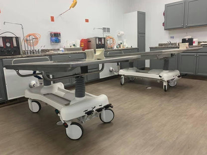 Bariatric 850 lb mortuary prep table with reinforced hydraulic base