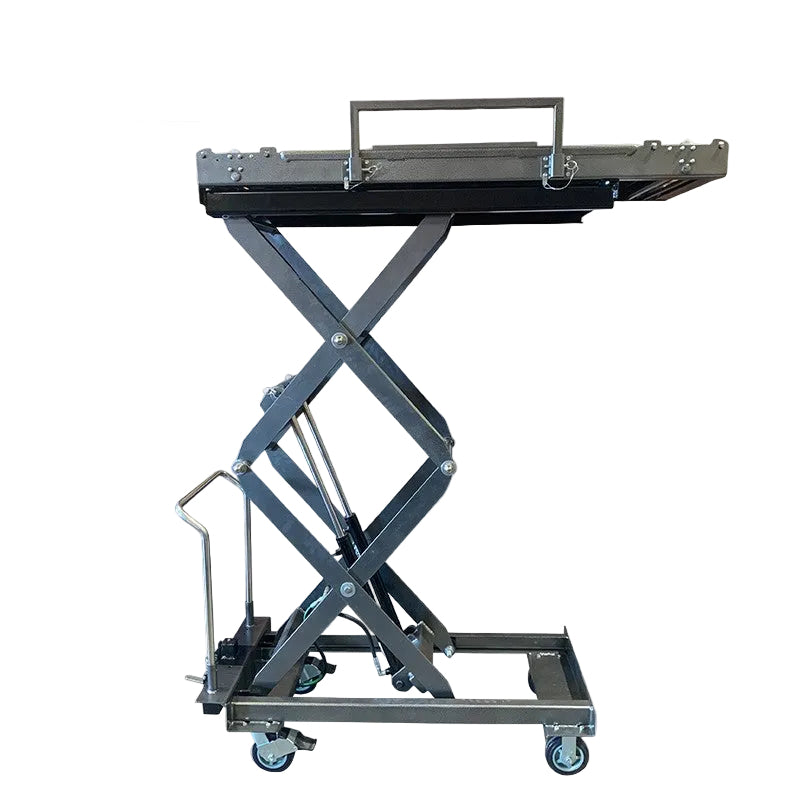 Funeral home scissor lift lowered to 20.5-inch loading height beside mortuary cooler