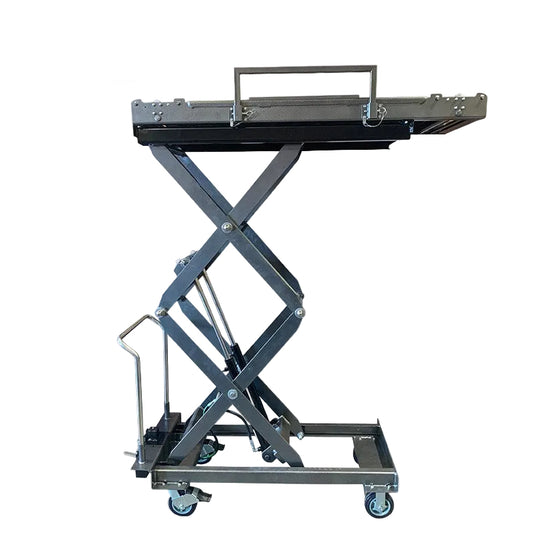 Funeral home scissor lift lowered to 20.5-inch loading height beside mortuary cooler