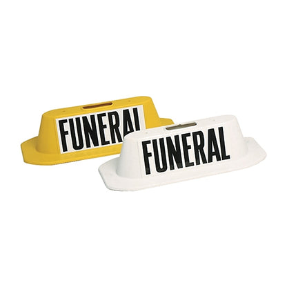 Yellow magnetic funeral safety marker beside the white version