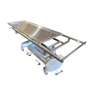 Hydraulic autopsy and morgue table with removable stainless steel top, durable ergonomic design, and OSHA-compliant construction for safe and efficient body preparation in medical examiner and mortuary facilities.