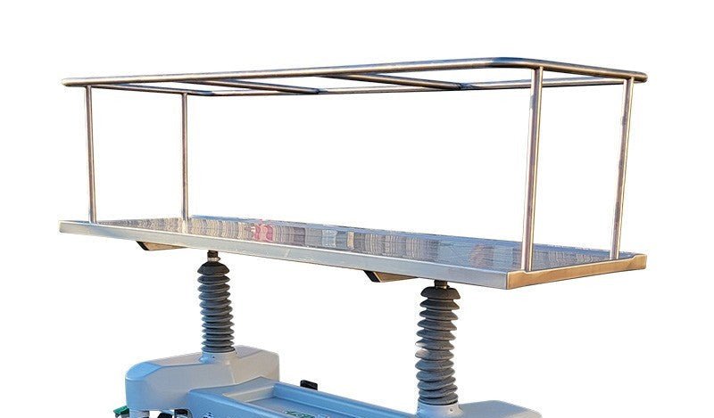 Foot-pedal operated hydraulic lift system on a stainless steel concealed transport gurney.