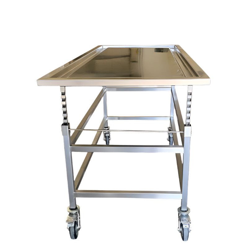 Multiple-level stainless steel embalming and preparation table designed for mortuary and funeral home use, featuring durable welded construction, ergonomic height design, and easy-to-clean surfaces for professional embalming procedures.
