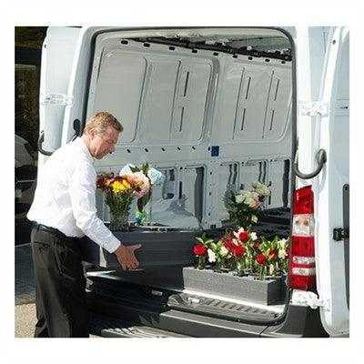 Six hole floral vase block with floral arrangement — in-use chapel transport view | Funeral Source One