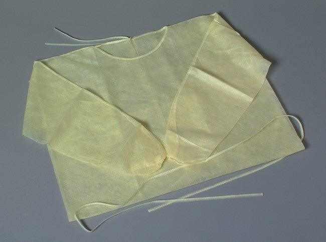 Yellow isolation gown tie closure detail, adjustable universal fit