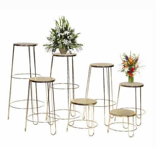 Set of seven round gold funeral floral basket stands in graduated sizes