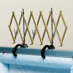 Expandable open-casket floral spray rack in gold anodized aluminum with padded hooks