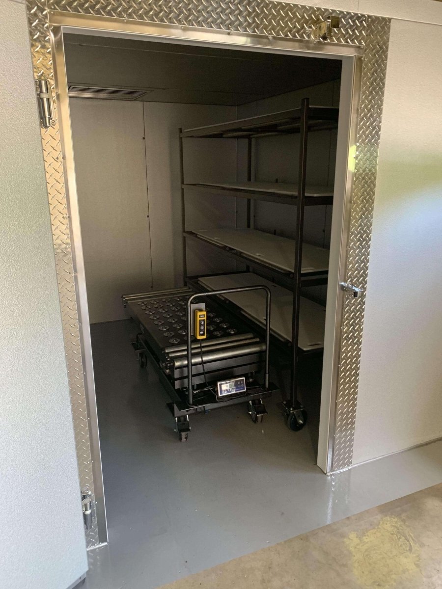 Floorless installation option for a walk-in mortuary cooler in a professional facility